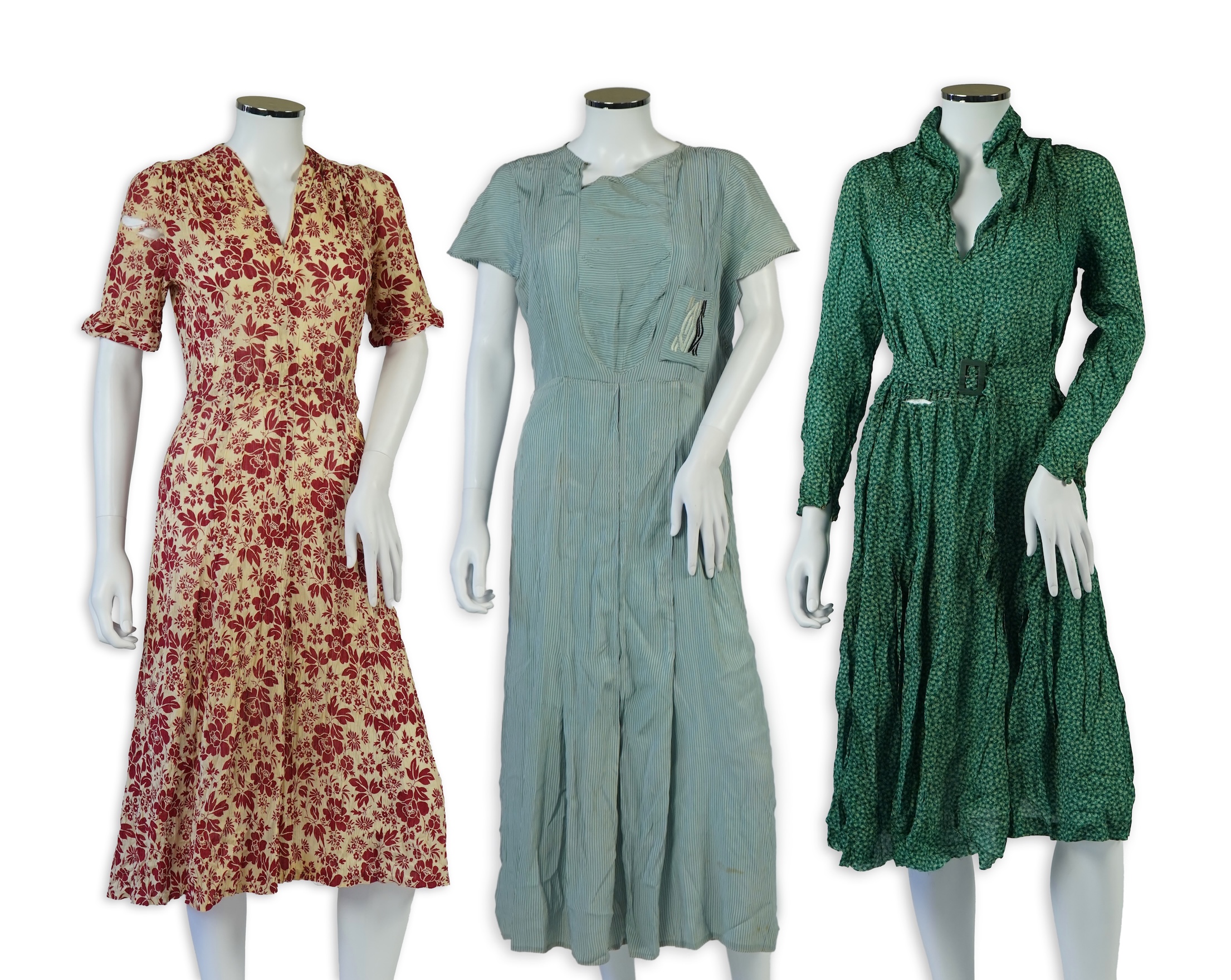 Two 1930's printed silk crepe summer day dresses together with a similar pale blue and black stripped summer day dress., Condition - the maroon and cream dress has damage to one sleeve, the green dress has worn under the